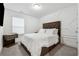 Cozy bedroom features decorative wall accents and a tufted headboard, creating a comfortable and inviting atmosphere at 43 N Auburn Landing Pl, Auburn, GA 30011