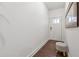 Bright entryway featuring hardwood floors and a white textured stool at 43 N Auburn Landing Pl, Auburn, GA 30011