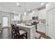 Well-lit kitchen with an island, stainless steel appliances, and hardwood floors at 43 N Auburn Landing Pl, Auburn, GA 30011