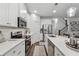 Modern kitchen with white cabinets, quartz countertops, and stainless steel appliances at 43 N Auburn Landing Pl, Auburn, GA 30011