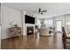 Inviting living room with a cozy fireplace, hardwood floors, and natural light at 43 N Auburn Landing Pl, Auburn, GA 30011