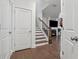 View of the stairway, fireplace, and living room at 43 N Auburn Landing Pl, Auburn, GA 30011