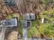 An aerial view of the neighborhood with tree lined streets and well maintained lawns at 9480 Hillside Dr, Roswell, GA 30076