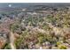 A high angle view of the neighborhood surrounded by beautiful, mature trees at 9480 Hillside Dr, Roswell, GA 30076