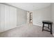 This bedroom features neutral walls, plush carpet, closet, and plenty of natural light at 9480 Hillside Dr, Roswell, GA 30076