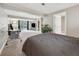 Spacious bedroom featuring plush carpet, a sliding glass door and an attached workspace at 9480 Hillside Dr, Roswell, GA 30076