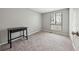 Neutral bedroom with carpeted floors, large window providing great natural light at 9480 Hillside Dr, Roswell, GA 30076