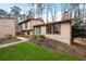 Stylish home exterior with tidy landscaping and a covered entry at 9480 Hillside Dr, Roswell, GA 30076