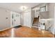 Spacious foyer with hardwood floors, a closet and an elegant staircase at 9480 Hillside Dr, Roswell, GA 30076