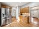 Spacious kitchen with stainless steel refrigerator, and ample cabinetry for storage at 9480 Hillside Dr, Roswell, GA 30076