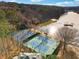 Aerial view of tennis courts and lake at 9480 Hillside Dr, Roswell, GA 30076