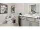 Half-bath features modern fixtures, vanity with sink, and ample lighting at 107 Holt Ln, Lawrenceville, GA 30046