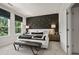 Stylish bedroom featuring a dark accent wall with starry decor and a large window at 107 Holt Ln, Lawrenceville, GA 30046