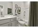 Bathroom with a bathtub and shower combination, stylish gray shower curtain, and sleek modern vanity at 109 Holt Ln, Lawrenceville, GA 30046