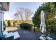 Outdoor back deck featuring seating and views of the surrounding landscaping at 271 Double Gate Ct, Sugar Hill, GA 30518