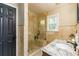 Bathroom featuring a glass shower with a bench and a granite countertop at 271 Double Gate Ct, Sugar Hill, GA 30518