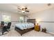 Bedroom with a ceiling fan, two windows, a desk, and a chair at 271 Double Gate Ct, Sugar Hill, GA 30518