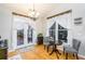 Cozy breakfast nook with hardwood floors, a chandelier, and a view to an outdoor deck at 271 Double Gate Ct, Sugar Hill, GA 30518