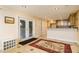 Kitchenette with tile floors, recessed lights, and double french doors leading to the outdoors at 271 Double Gate Ct, Sugar Hill, GA 30518