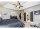 Spacious main bedroom with neutral tones, tray ceiling, and an adjoining bathroom at 271 Double Gate Ct, Sugar Hill, GA 30518