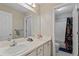 Bathroom featuring a double sink vanity with large mirror and a separate toilet and shower area at 2773 Saddle Horn Place Southwest Pl, Snellville, GA 30039