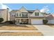 Charming two-story home with a two car garage and traditional stone accents at 2773 Saddle Horn Place Southwest Pl, Snellville, GA 30039