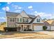 Charming two-story home with a stone and vinyl exterior, well-manicured lawn and three car garage at 2773 Saddle Horn Place Southwest Pl, Snellville, GA 30039