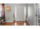 Foyer featuring a white front door flanked by sidelights, hardwood floors, and decorative accents at 2773 Saddle Horn Place Southwest Pl, Snellville, GA 30039