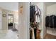 Walk-in closet with hanging clothes and shelving, leading to the en-suite bathroom at 2773 Saddle Horn Place Southwest Pl, Snellville, GA 30039