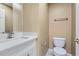 Bathroom with white vanity, quartz countertop, modern faucet, and toilet at 5885 Waggoner Cv, Rex, GA 30273