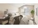 Bright bedroom featuring vaulted ceiling, large window, neutral walls, and coordinated bedding at 5885 Waggoner Cv, Rex, GA 30273