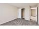 Bedroom featuring neutral walls and carpet, closet and doorway that lead to another room at 5885 Waggoner Cv, Rex, GA 30273