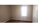 Bedroom with hardwood flooring and natural light from a window at 1385 Womack Ave, Atlanta, GA 30344