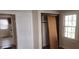 Bedroom features a closet and view into an adjacent room at 1385 Womack Ave, Atlanta, GA 30344