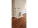 White brick fireplace in a living room with hardwood floors at 1385 Womack Ave, Atlanta, GA 30344