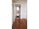 Hallway with hardwood floors and view into adjacent room at 1385 Womack Ave, Atlanta, GA 30344