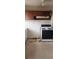 Kitchen features a black and white stove, and wood-paneled cabinets, offering ample storage space at 1385 Womack Ave, Atlanta, GA 30344