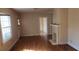 Living room features a decorative fireplace, hardwood floors, and natural light from large windows at 1385 Womack Ave, Atlanta, GA 30344