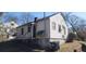 View shows home's exterior needing repair and yard in need of landscaping at 1385 Womack Ave, Atlanta, GA 30344
