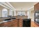 Kitchen with breakfast bar and sink, updated appliances, and hardwood floors at 2740 Heritage Bend Ct, Grayson, GA 30017