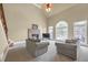Bright living room featuring a fireplace, vaulted ceiling, and large windows for natural light at 2740 Heritage Bend Ct, Grayson, GA 30017