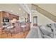 Open living space featuring a kitchen, staircase, and comfortable living room seating at 2740 Heritage Bend Ct, Grayson, GA 30017
