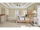 Comfortable main bedroom with neutral walls, four-poster bed, natural light, and carpet flooring at 2740 Heritage Bend Ct, Grayson, GA 30017