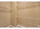 Neutral walk-in closet with shelving and carpet flooring at 2740 Heritage Bend Ct, Grayson, GA 30017