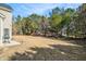 Backyard view of a patio and a lawn at 1200 St James Pl, Loganville, GA 30052