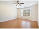 Bedroom with hardwood flooring, a ceiling fan, and a large window at 1200 St James Pl, Loganville, GA 30052