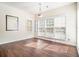 Bright living room featuring large windows and hardwood floors at 1200 St James Pl, Loganville, GA 30052