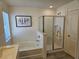 Beautiful bathroom showcasing tub, glass shower and modern fixtures at 2761 Sandy Rd, Conyers, GA 30013