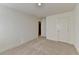 Carpeted bedroom featuring neutral carpet and closets at 2761 Sandy Rd, Conyers, GA 30013