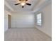 Bright bedroom features neutral carpet, closet, and a window at 2761 Sandy Rd, Conyers, GA 30013